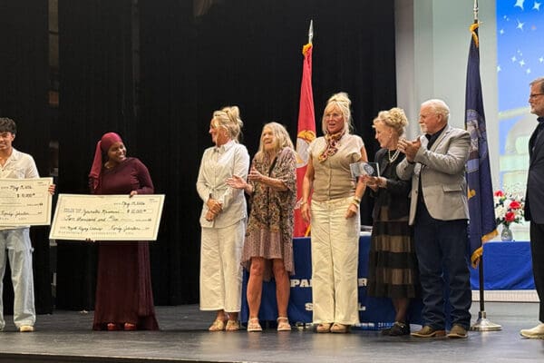 Randy Johnston presented scholarships to two Palo Duro students in honor of the late Frontz M. Myatt, the longtime educator and track coach.